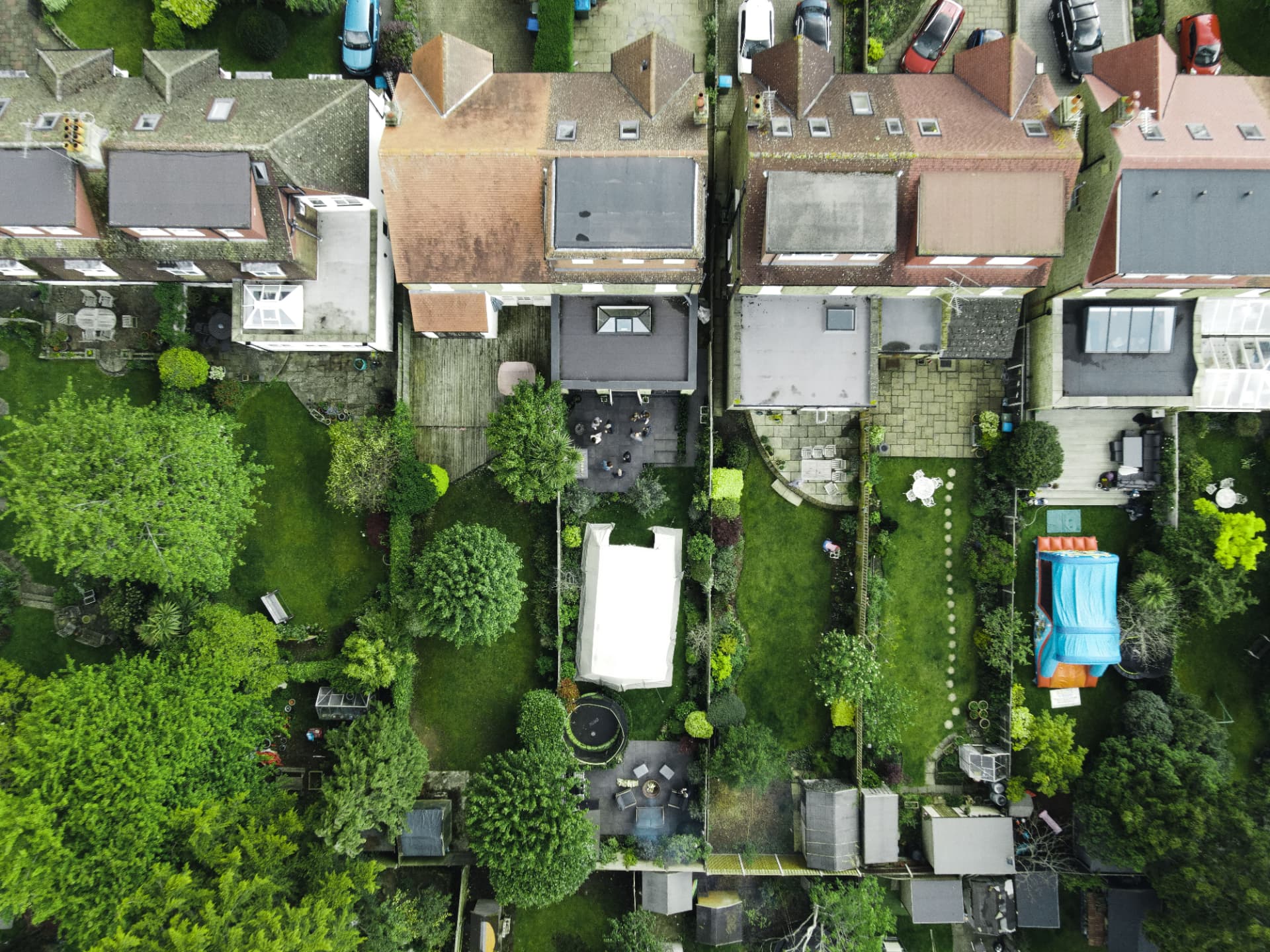 Aerial view of neighborhood backyards from above