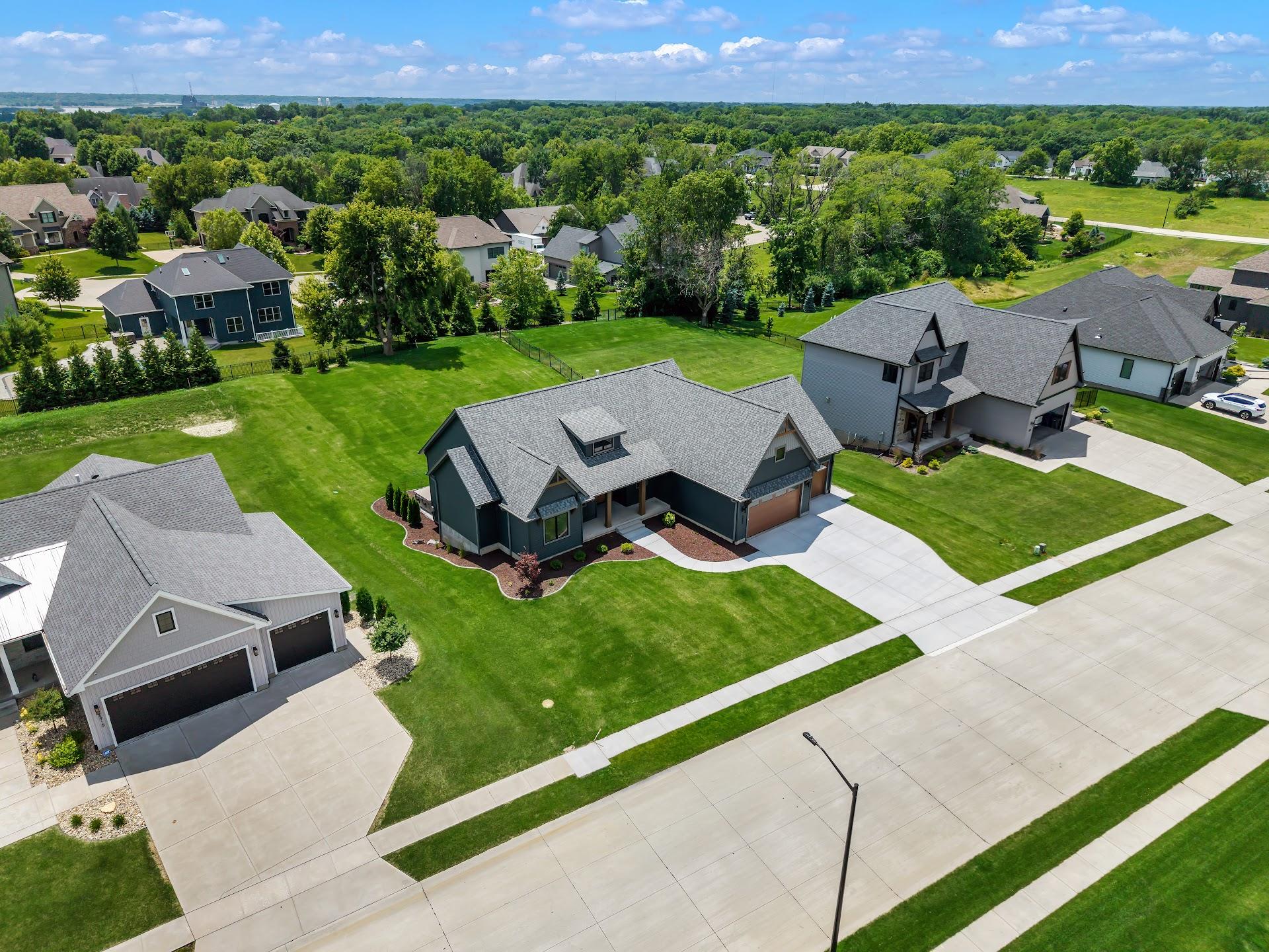 Aerial view of mature trees shading homes in a residential neighborhood